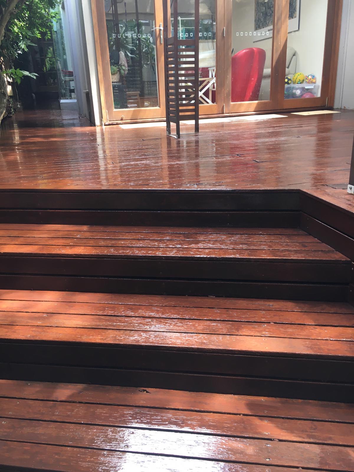Hardwood deck and steps freshly oiled to a deep red finish